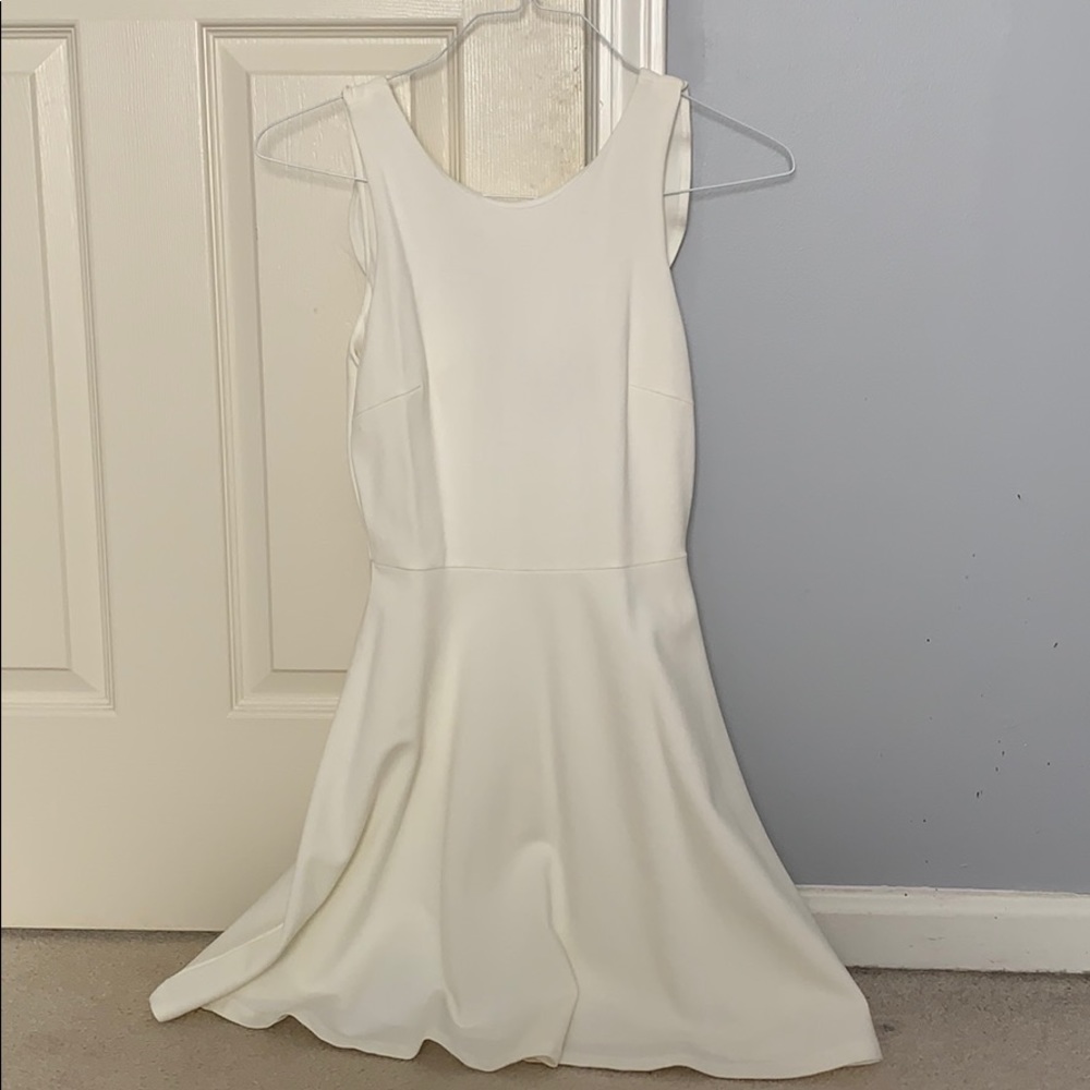 A fancy white mid-length dress